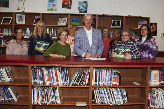 Judge Clawson recognized April as Child Abuse Prevention Month in Swisher County. Pictured are Lillian Araiza, Sharon Wyatt, Joyce Childers, Nancy House, Judge Michael Clawson, Lisa Hooper, Yvonne Fifer, Lynnett Walker, and Dr. Tori Marnell.