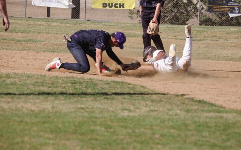Reynoldo Guerrero avoids the tag at 2nd and slides in safe