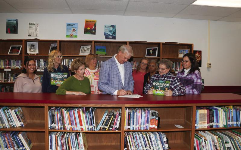 Judge Clawson signed the Child Abuse Prevention Proclamation recognizing April as Child Abuse Prevention Month in Swisher County. Pictured are Lillian Araiza, Sharon Wyatt, Joyce Childers, Nancy House, Judge Michael Clawson, Lisa Hooper, Yvonne Fifer, Lynnett Walker, and Dr. Tori Marnell.