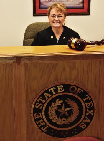 LAYING DOWN THE BIG GAVEL--Karen Boren is retiring from office as Justice of the Peace for Deaf Smith County effective Tuesday, March 31 and will be honored with a reception from 1:30 to 3:30 p.m. that day on the third floor of the Deaf Smith County Courthouse. Mrs. Boren, the lady of the law north and south of the Tierra Blanca, has served just under 41 years in law enforcement and as a JP in Deaf Smith County. (Photo by Jim Steiert)