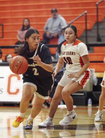 Ellyana Tijerina brings the ball up the court for the Lady Whitefaces.