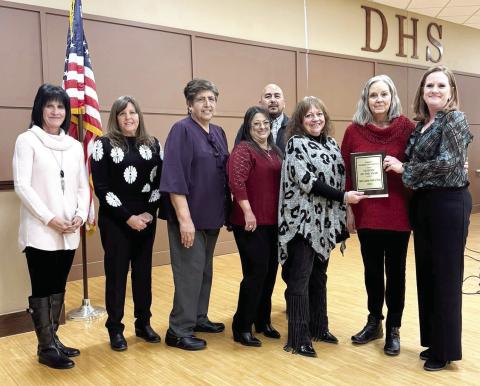 Above, the Citizen of the Year Award at the Dimmitt Chamber of Commerce was Hands of Hope. Live auction winners at the annual event included George Strait Tickets going to Kalan and Lana Steinle, a griddle won by Levi Lunsford, Flowers for a Year-WALK Cattle Company (sent to CVL), a Glock went to Mike and Cindy Odom, a recliner went to Kalan and Lana Steinle and a Kid’s Gator went to Zack and Taylor Riley. (Courtesy photo)