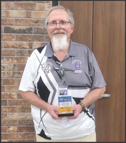 Don Bell was recognized at the district meet with the Compass Award, naming him District Coach of the Year
