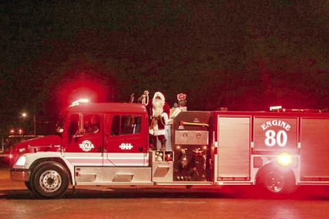 Santa and the Grinch visit Tulia Fire Department