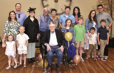 CENTENNIAL CELEBRATION--William Eugene “Bub” Sparks, seated center, marked his 100th birthday on Monday, May 4. A reception was held in his honor Sunday, May 3 in the Fellowship Hall of First Baptist Church with a huge crowd of family and friends in attendance. Here, Bub is shown gathered with members of the Sparks clan for a family photo to commemorate the occasion. (Photo by Jim Steiert)