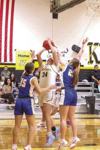The Nazareth Swiftettes topped Kress 52-12 Friday night. Above, Madison Brockman (15) and Lexi Ramaekers (25) go for the steal against the Lady Roos. (CCN photo)