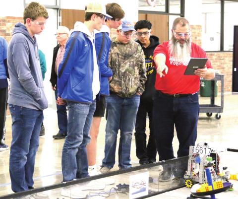 Naz Robotics team members Tanner Birkenfeld, Tagan Ramsey and Luke Schulte for team 16617, and Harrison Meador and Adrian Rios, team 18570 competed at the third West and Panhandle North League Meet. (photo by Chloe Birkenfeld)