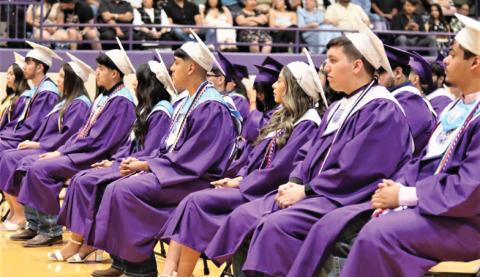 Dimmitt High School seniors, parents, family and friends attended the commencement ceremony for seniors who closed the door on high school to take a big step into the future (top photo). Many will be attending college, trade schools, joining the military or getting jobs as they continue their journey into adulthood. The DHS valedictorian was Veera Bhakta (bottom left) and the salutatorian was Isaura Guido (bottom right).