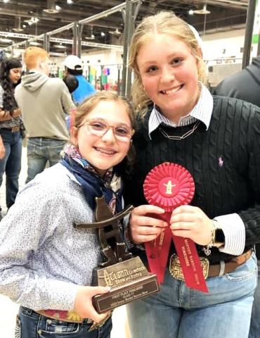 Nazareth FFA Chesney Farris and Autumn Birkenfeld won first and second in the Yorkshire HW barrow class (77) at the Houston Livestock Show.