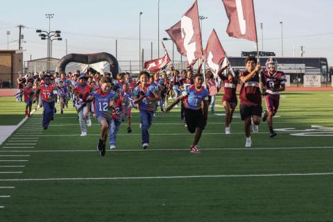 Future Hornets from the Tulia Junior High and Tulia Gators led the team onto the field for the Homecoming game.