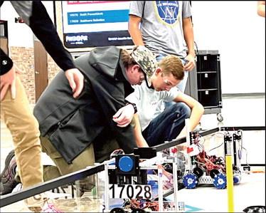 Nazareth Robotics team members Michael Fulkerson and Spencer Acker prepare for competition at the Amarillo scrimmage this past weekend offering the rookies a good opportunity to prepare for the upcoming season.