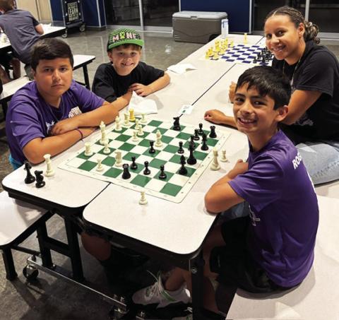 Richardson Elementary students traveled to Lubbock, TX to compete in the annual Communities in Schools of the South Plains Elementary Chess Tournament at Miller Elementary. All the students did great and Campbell Neinast made it to the playoffs after winning all three of his matches. Pictured (above, right) are Felix Hernandez, Kendra Cantrell-CIS Coordinator, Dare Sullivan and Campbell Neinast.