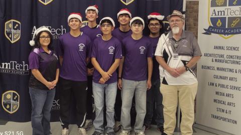(Left to right) Mrs. Rocio Morales, Baylor Navarro, Rudy Fuentes, Yandel Sanchez, Keenan Hernandez, Diego Duenes, JJ Rodriguez, Mr. Don Bell. This team is in 7th place, remaining inside the critical top eight cutoff required to move forward. Their steady growth since the first meet reflects their dedication to improving both robot performance and match strategy.