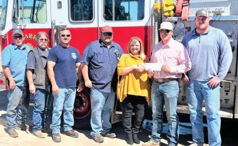 The 100 Club of the Texas Panhandle made a stop at the Nazareth Volunteer Fire Department to visit with and present the VFD with a $15,000 check. The donation to the fire department, as well as several other volunteer fire departments in the Panhandle, was made possible through a hat promotion by Hometown Hats Co. of Lubbock, Lubbock Professional Firefighters Association, and Amarillo Professional Firefighters Local 542, with distribution of funds through the 100 Club.