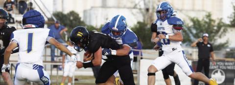 The Nazareth Swifts (above, against Happy in week one) lost to Borden County Friday 50-0. Pictured above are Rhett Ethridge (5), Copper Farris (2), Cole Braker (20) and Lin - coln Pohlmeier (1).
