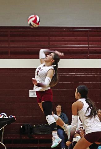 Marleigh Russell jumps high to hit the ball