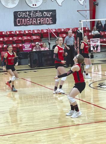 JV Lady Cougar, Destiny York, passes the ball in their game against Wildorado JV.