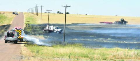 TAKING FIRE PRECAUTION--Well aware of the huge fuel load present going into fall and leading on to the winter and spring fire season, Deaf Smith County commissioners approved providing fire breaks to private landowners at their October 14 session. Fire breaks can buy precious time for fire crews to arrive. Even with the aid of helpful neighbors, wildfires spread fast and minutes count. (Photo by Jim Steiert)