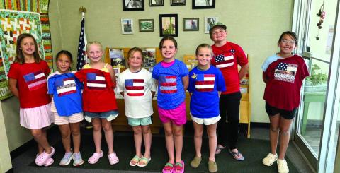 To get ready for the nation's 250th birthday, Castro Coun - ty 4-H made American Flag T-shirts and coasters June 14. The group learned about using fusible to make our flag, sewing on a T-shirt and using a sewing machine to not stitch both sides, strip piecing to make a coaster and us - ing fusible to add stars. (Courtesy photos)