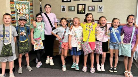 Castro County 4-Hers recently attended a sewing workshop where they made messenger bags. The 10 youth selected fabrics, did the sewing and topstitch and added straps. Parents assisting Extension Agent Felice Acker wereKarenWanjura, Madelyn Kern, Cindy Gerber and extension secretary Missy Kleman.