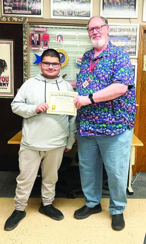 Bryan Tovar earned a $500 scholarship for his 1st place finish at the Red Raider Classic UIL Current Events Invitational. Tovar is pictured with Hereford High School teacher/UIL coach Richard Lamascus.