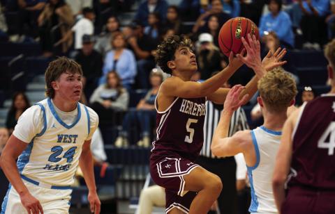 Jaxon Lucio drives to the basket against West Plains Dec. 22. Hereford lost the district contest 84-44. (Courtesy photo)