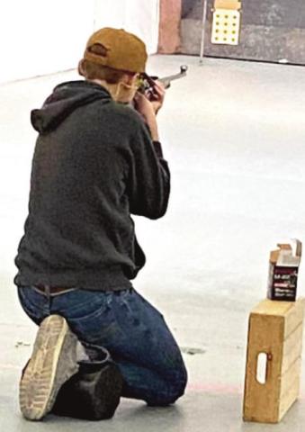 (Photo right) Castro County 4-H Miles Nelson competing at the District 2 Rifle Contest.