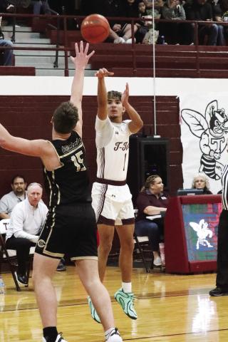 Logan Becerra shoots for three