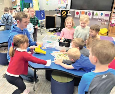 On the 100th day of school at Nazareth ISD, Castro County Extension Agent Felice Acker and Texas 4-H STEM Ambassador Spencer Acker joined the Pre-K kids. Spencer combined STEM with folktales to build houses from straws, popsicle sticks and Legos as a part of the outreach education with schools.