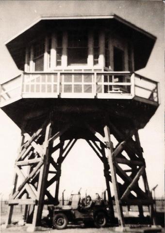 GUARD TOWER—This is a view of one of the 12 guard towers at the Prisoner of War camp just outside of Hereford in Castro County that housed Italian POWs. The jeep beneath the building provides scale.