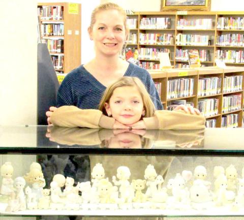 Displayer of the Month is a Precious Moments figurine display belonging to Rhonda George of Hart, represented by daughter, Kellie O’Connor, and granddaughter, Eleanor.