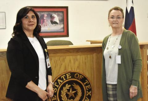 PASSING OF THE GAVEL-It was a changing of the guard at the March 24 as county commissioners voted unanimously to designate Alma Mancinas, left, as acting Justice of the Peace effective April 1 with the retirement of Karen Boren, right, as Justice of the Peace effective March 31. Mrs. Mancinas has worked with Mrs. Boren for 10 years and was unopposed in the March 3 Primary election.
