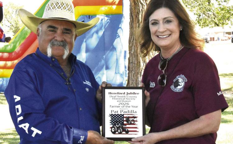 TOP FARMER/RANCHER--Pat Padilla accepts the Farmer/