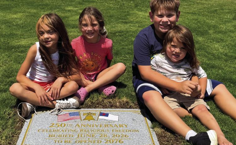 Far left: Pastors Lupe Acevedo, Nathan Adams and Ted Taylor representing the Hereford Ministerial Alliance buried the 250th Celebration of Religious Freedom Time Capsule at the Courthouse. Left, items in the time capsule are displayed. Above, left, the capsule is buried and also pictured are four Hereford youngsters. When the capsule is opened in 50 years Lana Lujan will be 56, Amarah Lujan will be 57, Ezra Taylor will be 59 and Eli Martinez will be 52. (Courtesy photos)