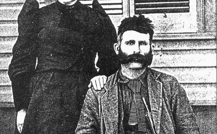 Charles and Katherine Harlan photo in front of first county courthouse, Dimmitt.