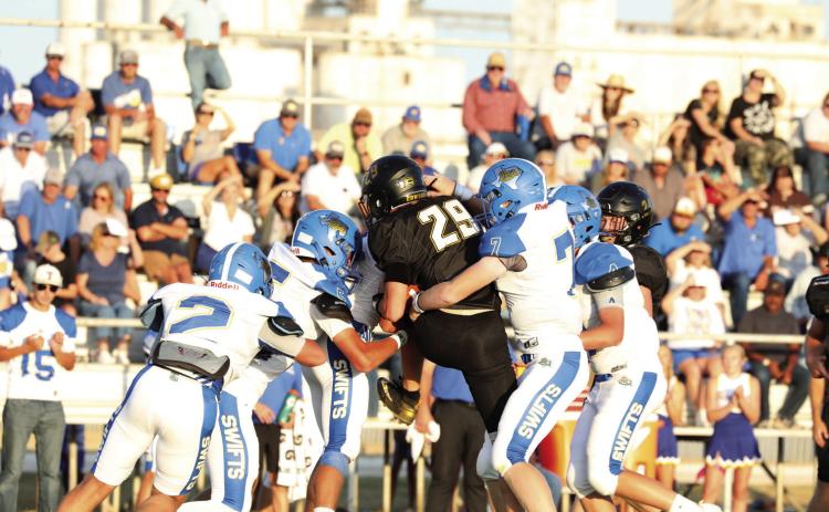 Rhett Eldridge (left) throws the ball for Nazareth against Happy Friday night.