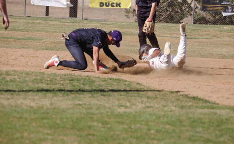 Reynoldo Guerrero avoids the tag at 2nd and slides in safe
