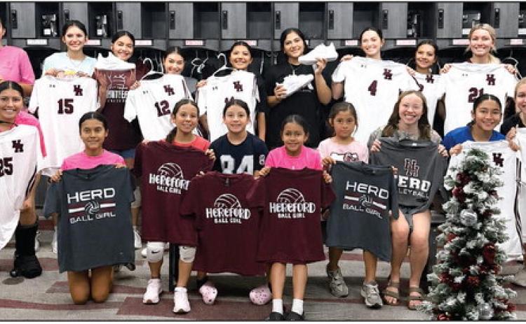 Before facing Bushland and Tascosa in a Friday scrimmage, the Lady Whitefaces received their jerseys and paused for a picture with new ball girls for the volleyball team. Tuesday the Lady Herd take on Palo Duro on the road in the season opener. (Courtesy photo)