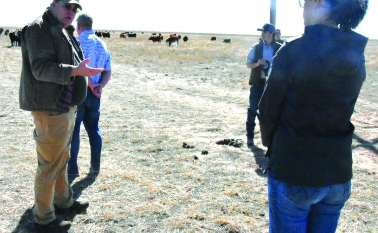 PLANNING WATER FUTURE--Dr. Chris Grotegut speaks to a field trip group on February 24 concerning grazing land management that can enhance recharge to the Ogallala aquifer. Dr. Grotegut spoke February 25 and detailed work toward a water plan for Hereford. (Photo by Jim Steiert)