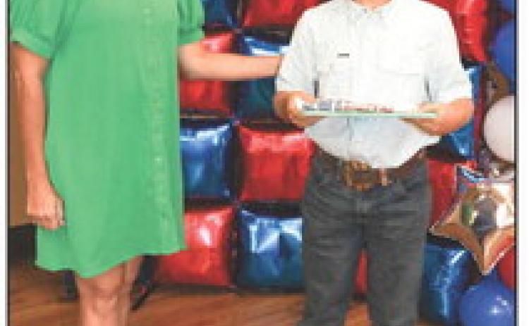 Christina Flowers presented Brooks Brown with a Project pin