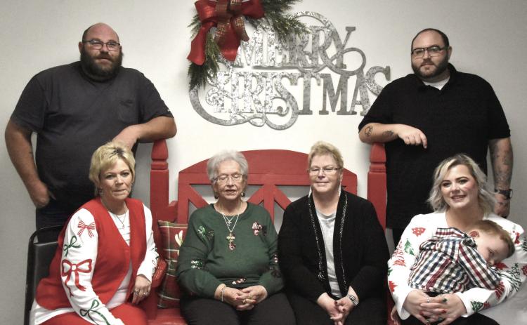 MARKING A MILESTONE—Members of the family of Mary Ann Resch-Fowler, who played a big role in getting the annual event started, gathered with her at the holiday meal during the 35th edition of the Festival of Trees at the Hereford Senior Citizens Center. Pictured from let are David O’Neal, Deana Grissom, Mary Ann Resch-Fowler, Debbie Wait, Rebecca Grissom, Elliott Sowell, and Bobby O’Neal. Many in the company were small children when the first Festival was held in 1990. (Photo by Jim Steiert)