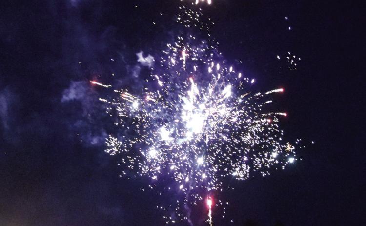 LIGHTING UP THE NIGHT--A spectacular fireworks display over Dameron Park in downtown Hereford wrapped up the 250th birthday celebration of America's Declaration of Independence on Saturday evening, July 4. People watched from the park, and from parking lots all over town. (Photos by Jim Steiert)