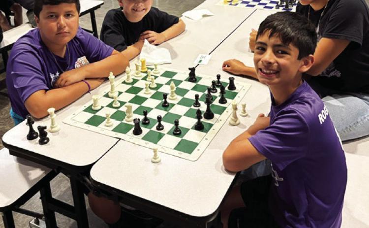 Richardson Elementary students traveled to Lubbock, TX to compete in the annual Communities in Schools of the South Plains Elementary Chess Tournament at Miller Elementary. All the students did great and Campbell Neinast made it to the playoffs after winning all three of his matches. Pictured (above, right) are Felix Hernandez, Kendra Cantrell-CIS Coordinator, Dare Sullivan and Campbell Neinast.