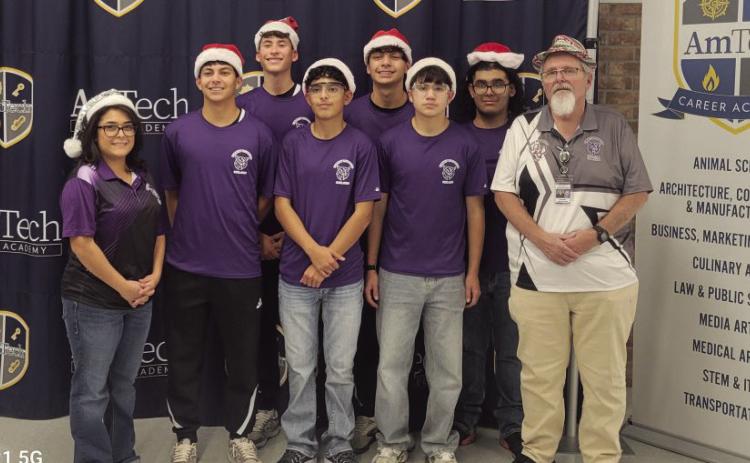 (Left to right) Mrs. Rocio Morales, Baylor Navarro, Rudy Fuentes, Yandel Sanchez, Keenan Hernandez, Diego Duenes, JJ Rodriguez, Mr. Don Bell. This team is in 7th place, remaining inside the critical top eight cutoff required to move forward. Their steady growth since the first meet reflects their dedication to improving both robot performance and match strategy.