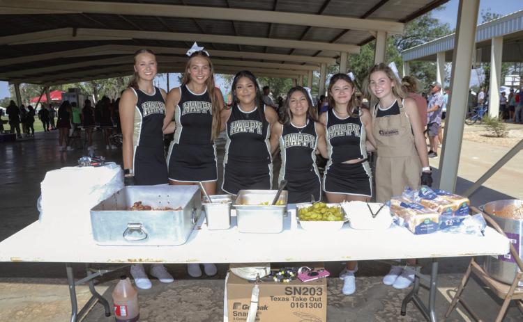 Happy High School Cheerleaders served BBQ meals at the Picnic lunch
