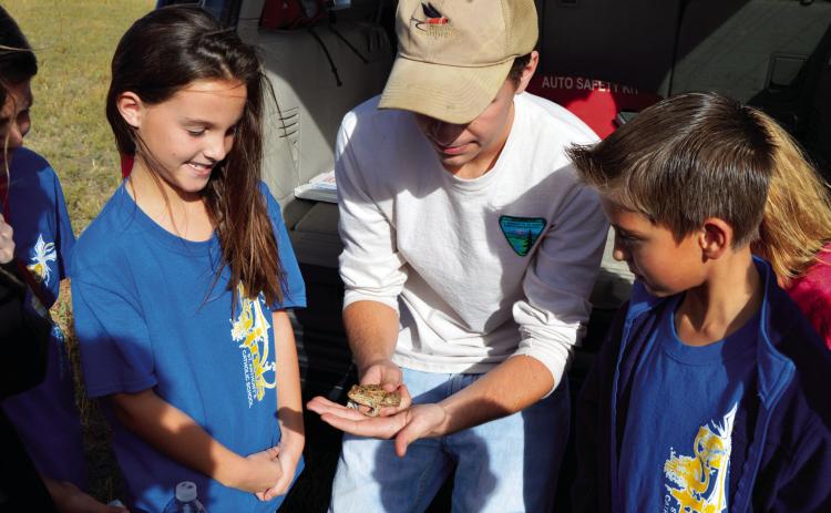 WHAT AN OPPORTUNITY--Curious school kids can learn a ton participating in outdoor adventures where they get to see and even feel fascinating critters and plants. (Photo by Jim Steiert)