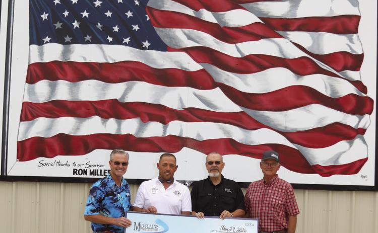 Mid-Plains Communications presented a donation to the Tulia Volunteer Fire Department as a way to give back to the community. Mid-Plains plans to make similar donations to other fire departments in their service area. Pictured are Mid-Plains General Manager Dusty George, Fire Chief Johnny Shelburne, City Manager BJ Potts, and Mid-Plains Board President Mikeal Barnes.