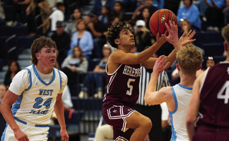 Jaxon Lucio drives to the basket against West Plains Dec. 22. Hereford lost the district contest 84-44. (Courtesy photo)