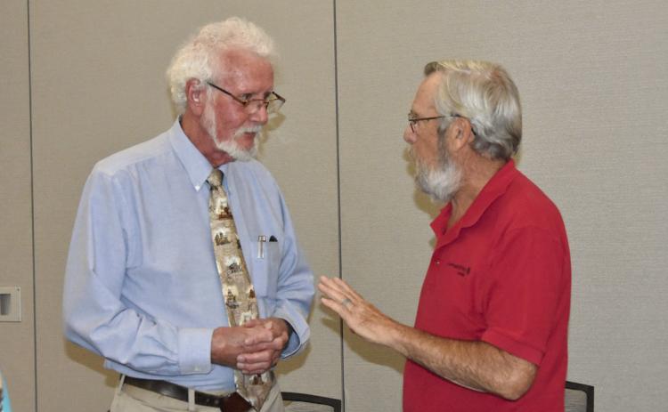 DID YOU REALLY?--Joe D. Rogers, Registered Professional Archeologist, visits with Dean Sanders of Levelland following his presentation to the Texas Association of Healthcare Volunteers during their District 1 meeting in Hereford on September 18. He fascinated the gathering with takes on historic finds. (Photo by Jim Steiert)