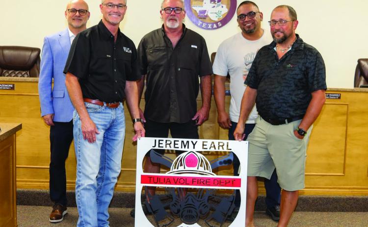 City Council presented Jeremy Earl with as sign in recognition of 30 years of service to the Tulia Fire Department. Pictured are Robert Bazemore, Dusty George, Jed Owens, Bibo Ramirez, and Jeremy Earl.